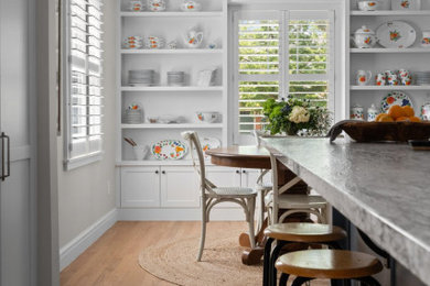 Inspiration for a mid-sized transitional kitchen/dining room combo remodel in Detroit with white walls