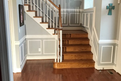 Example of a mid-sized transitional wooden l-shaped wood railing staircase design in Richmond with painted risers