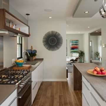 Open walnut cabinet enclosing range hood