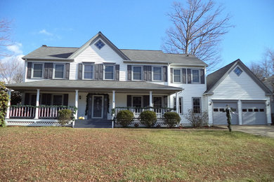 Inspiration for a large timeless blue two-story vinyl exterior home remodel in DC Metro