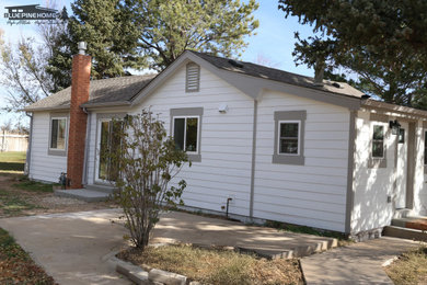 Example of a country exterior home design in Denver