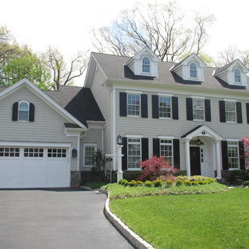 Transitional Colonial Home Exterior with Symmetrical Facade