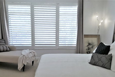 This is an example of a transitional bedroom in Perth.
