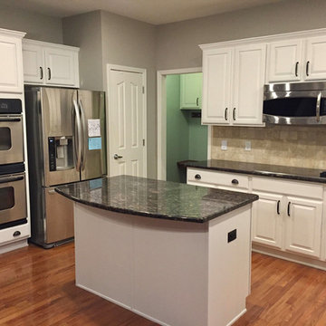 Cabinets Refinished from Cherry to White