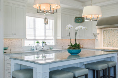 Mid-sized transitional medium tone wood floor kitchen photo in Philadelphia with recessed-panel cabinets, white cabinets, multicolored backsplash, paneled appliances and an island