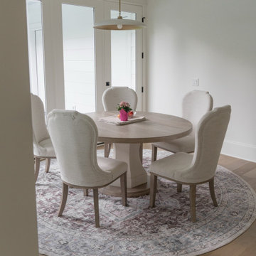 Bright and Casual Dining Room with Upholstered Chairs and French Doors