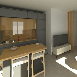 Small contemporary kitchen pantry ideas - Example of a small trendy single-wall laminate floor and beige floor kitchen pantry design in Paris with a single-bowl sink, wood countertops, white backsplash, marble backsplash, paneled appliances and an island