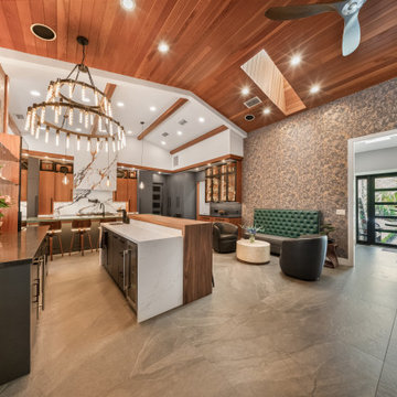 Modern Entertaining Hub with Dual Islands and Chandelier