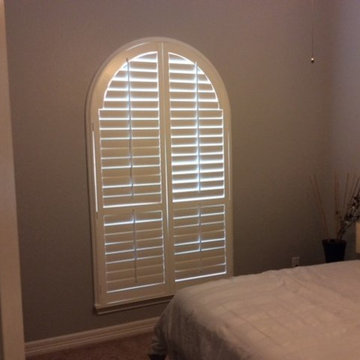 Custom arched plantation shutters