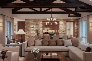 Design ideas for a large transitional open concept living room in Chicago with beige walls, vaulted and brick walls.