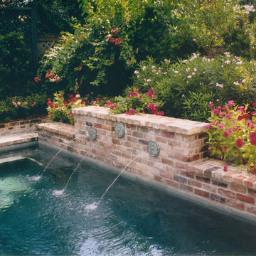 Pool, waterfall, and landscaping
