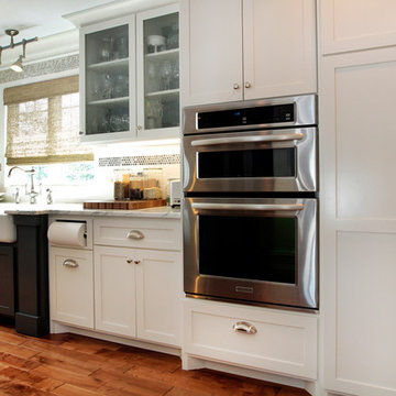 A chef's kitchen with cozy hearth room and spacious dining room