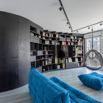 Une bibliothèque singulière dans une pièce de vie agrandie