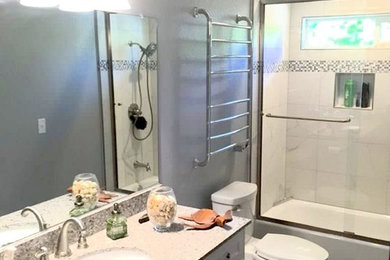 Example of a transitional bathroom design in Other