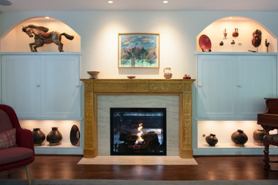 Living room - transitional living room idea in DC Metro with a two-sided fireplace and a stone fireplace