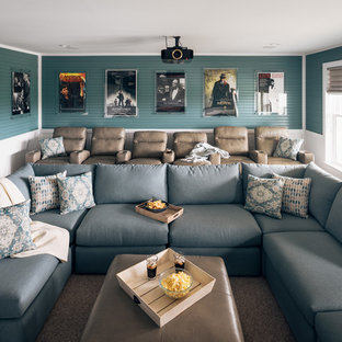 Large coastal enclosed carpeted and beige floor home theater photo in Other with blue walls and a projector screen