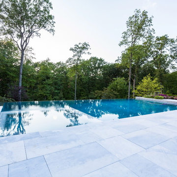 Luxury vanishing edge swimming pool and outdoor living area Ridgewood NJ