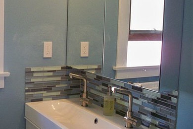 Example of a trendy white tile and glass tile tub/shower combo design in San Diego with flat-panel cabinets, white cabinets and blue walls