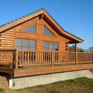 Cedar half log siding with butt-n-pass corners