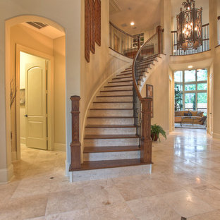 Mixed traditional wood staircase in Houston with travertine risers.