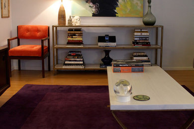 Small 1960s open concept light wood floor family room photo in Los Angeles with blue walls and a wall-mounted tv
