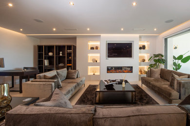 This is an example of an expansive modern open plan living room in Malaga with porcelain flooring.