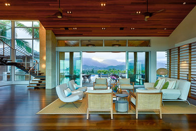Inspiration for a mid-sized tropical open concept and formal dark wood floor and brown floor living room remodel in Hawaii with beige walls, no fireplace and no tv