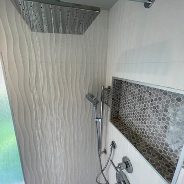 Shower/tub conversion to enlarged shower