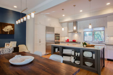 Inspiration for a mid-sized eclectic light wood floor and brown floor kitchen/dining room combo remodel in DC Metro with blue walls and no fireplace