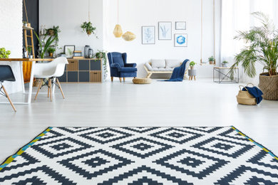 Inspiration for a mid-sized modern loft-style wallpaper living room remodel in Miami with white walls