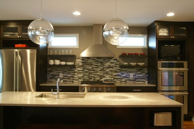 Eat-in kitchen - mid-sized transitional l-shaped medium tone wood floor eat-in kitchen idea in Atlanta with an undermount sink, open cabinets, dark wood cabinets, quartz countertops, multicolored backsplash, matchstick tile backsplash, stainless steel appliances and an island