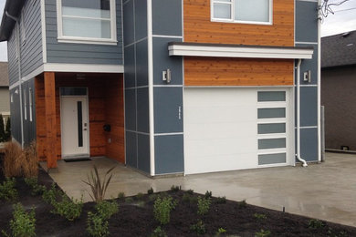 Mid-sized trendy multicolored two-story mixed siding exterior home photo in Vancouver