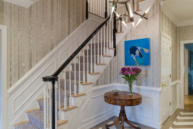 This is an example of a mid-sized modern foyer in Richmond with metallic walls, marble floors and grey floor.