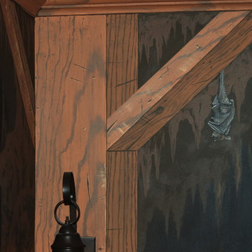 The Bat Cave Themed Mural in a stairway and lower level by Tom Taylor