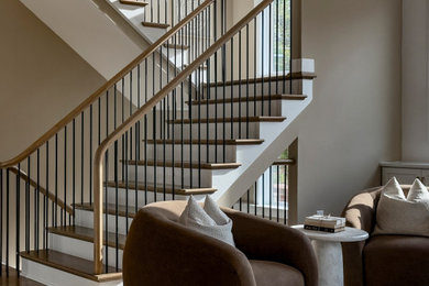 Mid-sized minimalist wooden u-shaped mixed material railing staircase photo in DC Metro with painted risers