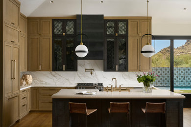 Kitchen - contemporary medium tone wood floor kitchen idea in Phoenix with an undermount sink, quartz countertops, paneled appliances and an island