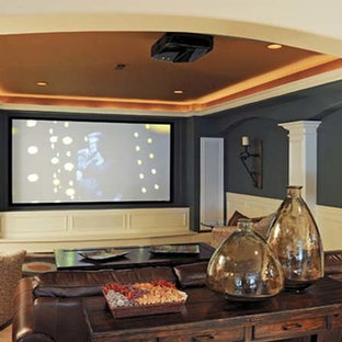 Home theater - mid-sized transitional open concept carpeted home theater idea in Louisville with blue walls and a projector screen