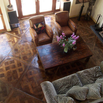 A Living Room With Wide Board Antique Parquet Flooring