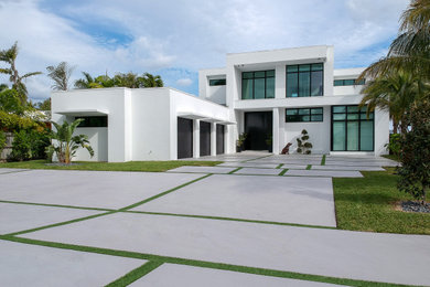 Example of a mid-sized minimalist white two-story house exterior design in Miami with a white roof