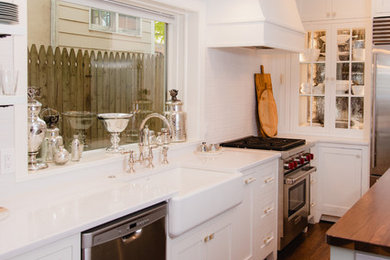 Inspiration for a small transitional l-shaped dark wood floor and brown floor eat-in kitchen remodel in Baltimore with a farmhouse sink, shaker cabinets, white cabinets, quartz countertops, white backsplash, cement tile backsplash, stainless steel appliances, an island and white countertops