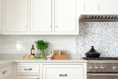 Inspiration for a large contemporary u-shaped light wood floor and beige floor open concept kitchen remodel in Portland Maine with a single-bowl sink, shaker cabinets, white cabinets, quartz countertops, gray backsplash, marble backsplash, stainless steel appliances, an island and white countertops