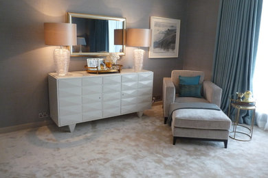 Inspiration for a modern master bedroom in London with grey walls, carpet and grey floors.