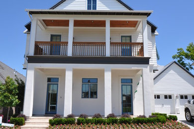 Mid-sized transitional white two-story gable roof photo in New Orleans