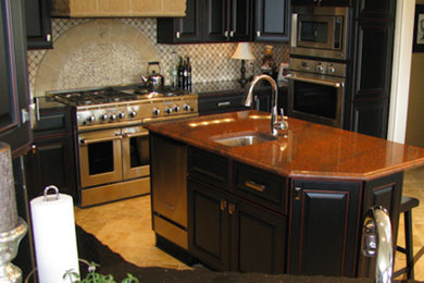 Example of a mid-sized ceramic tile kitchen design in Other with a drop-in sink, recessed-panel cabinets, black cabinets, quartz countertops and an island