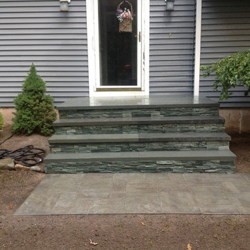 veneered cultured stone with bluestone treads