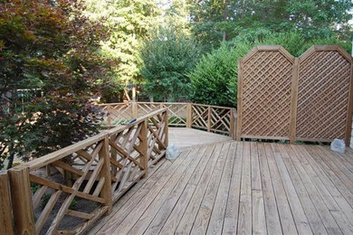 Mid-sized elegant backyard deck photo in Raleigh with no cover