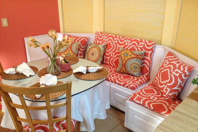 Eat-in kitchen - mid-sized mediterranean ceramic tile eat-in kitchen idea in Other with raised-panel cabinets and white cabinets