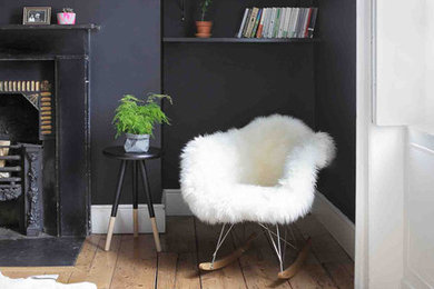 Photo of an eclectic living room in Dublin with black walls.