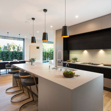 Open Kitchen with Large Island and Seamless Indoor-Outdoor Connection
