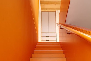 Mid-sized contemporary straight staircase in London.
